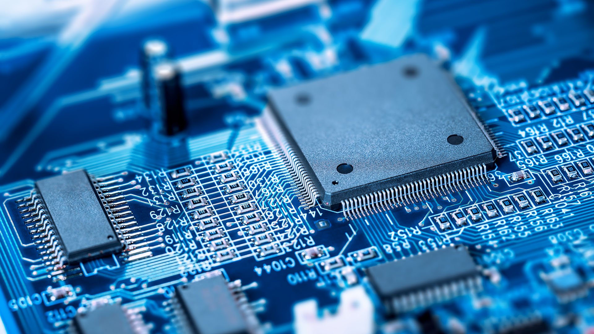 A close-up image of a semiconductor chip on a circuit board